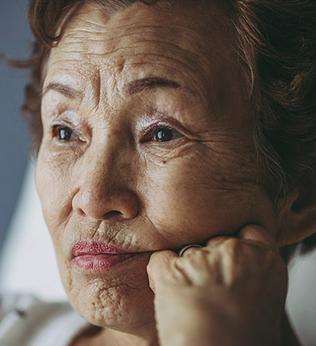 Photo of woman looking pensive