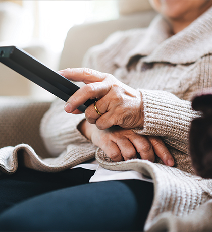 Photo of a hand holding a tv remote