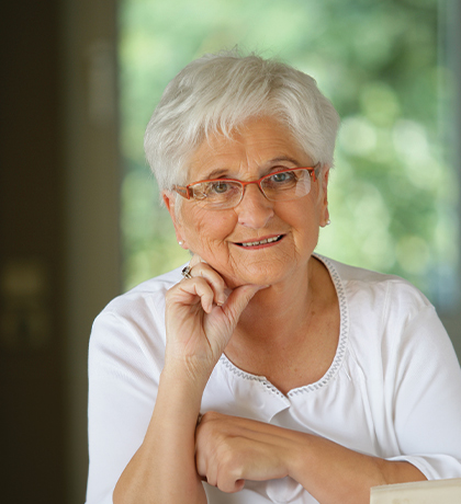 Photo of woman smiling pensively