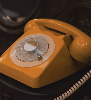 Photo of a retro orange dial telephone