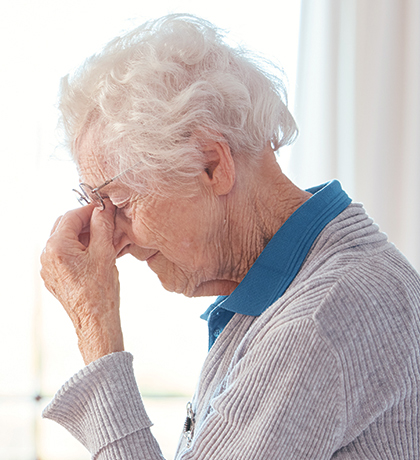 Photo of a woman pinching the bridge of her nose