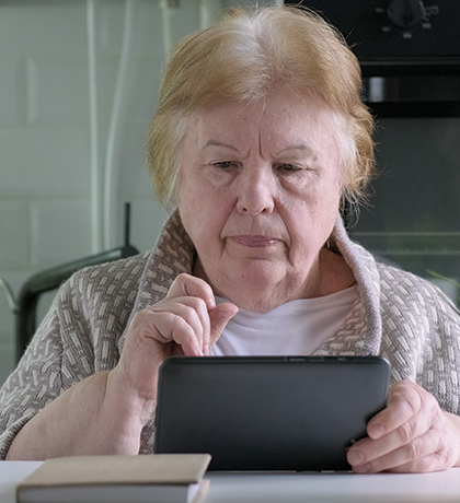 Photo of woman using a tablet