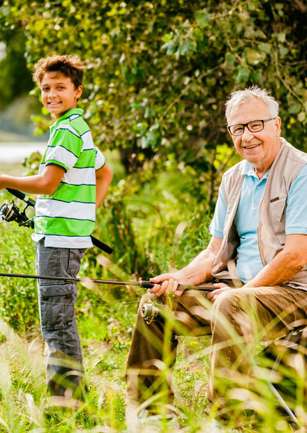 Elderly man and young boy fishing