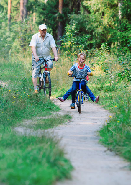 Grandfather and grandson on bikes