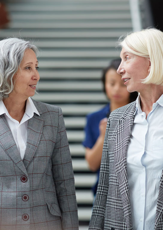 Two senior lawyers walking 