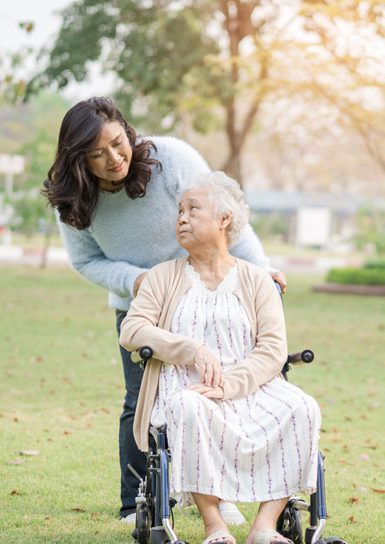 Senior woman with adult child in the park