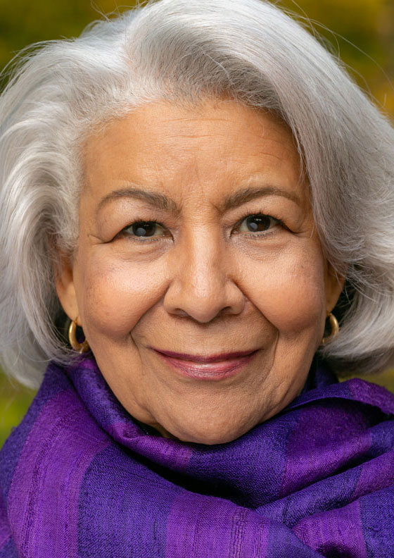 Strong senior woman wearing a purple scarf