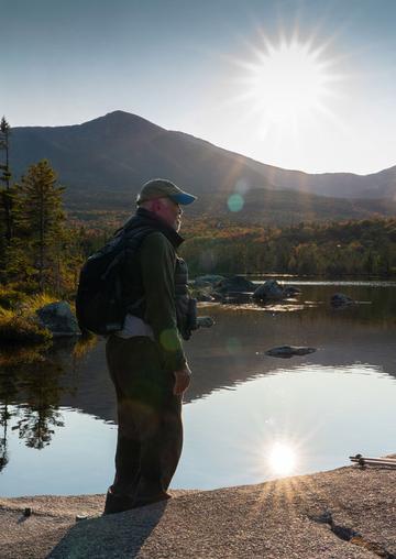 Man beside lake