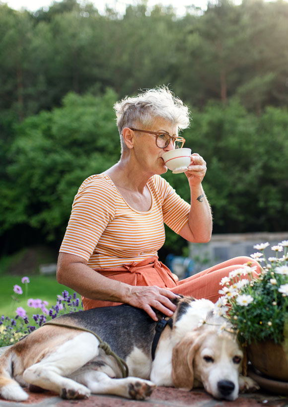 Elderly woman outside with dog