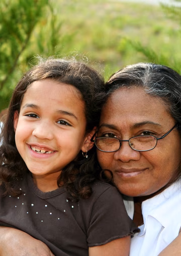 Elderly couple with granddaughter