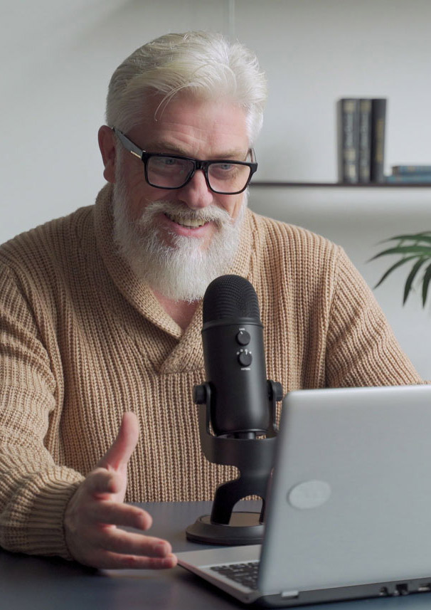 Elderly man recording podcast
