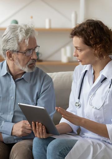 Elderly man and nurse