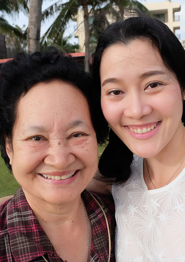 Senior mother and adult daughter taking a selfie