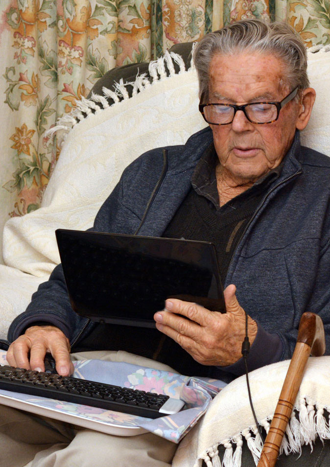 Senior man using a tablet