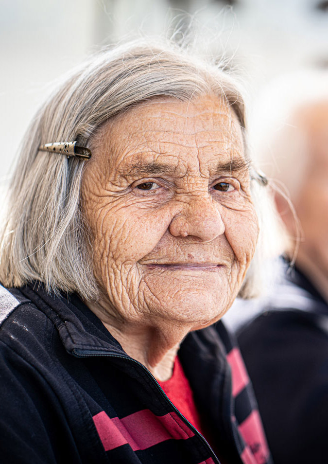 Elderly woman looking at the camera