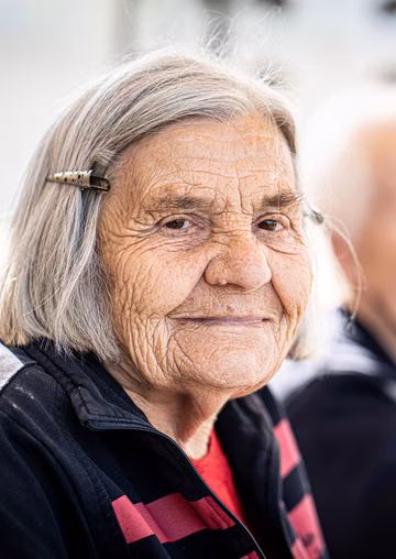 Elderly woman looking at the camera
