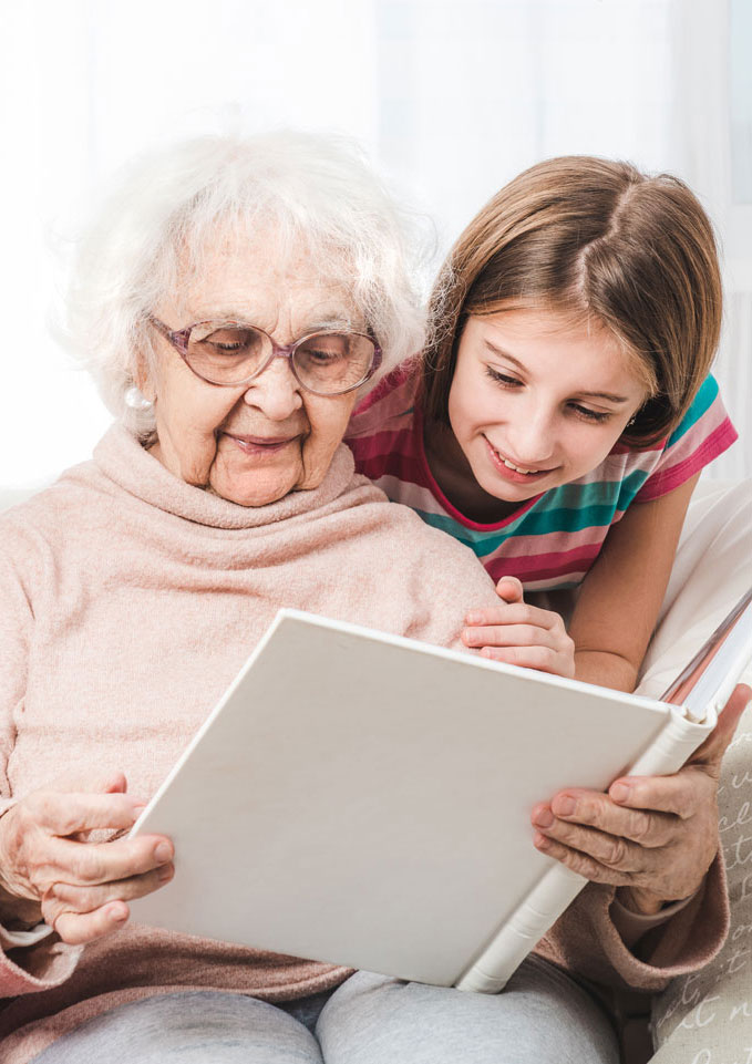 Grandmother and granddaughter reading