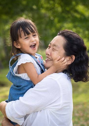 Grandmother and Granddaughter laughing