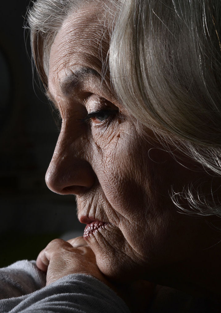 Sad elderly woman