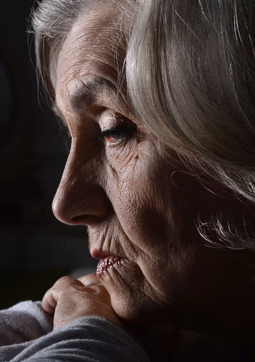 Sad elderly woman