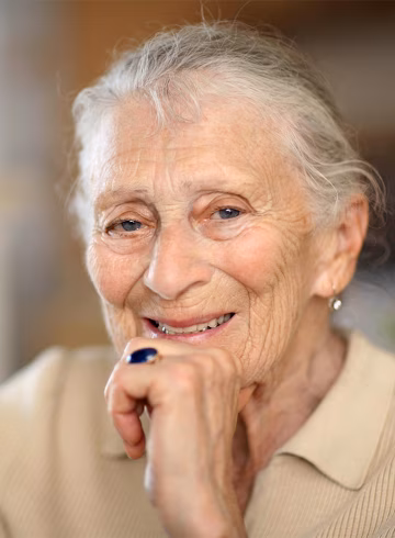 Photo of older lady smiling at camera