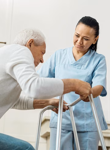 Photo of man with walker and nurse