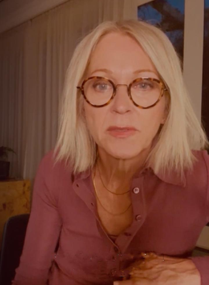 Photo of reporter Tracy Curro wearing tortoiseshell glasses