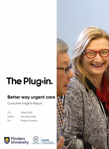 Photo of woman wearing red glasses smiling at a man