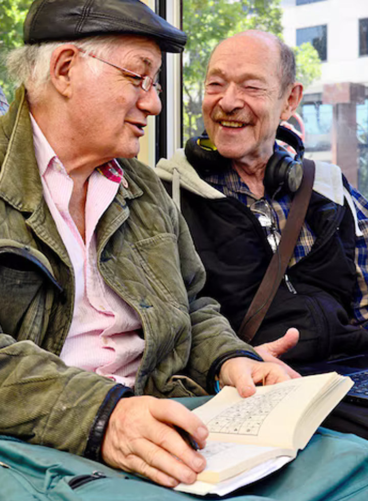 Photo of two men enjoying a conversation