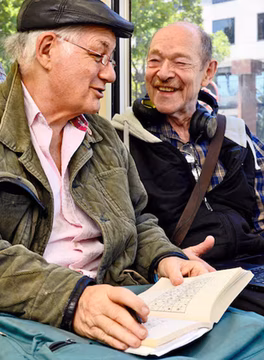 Photo of two men enjoying a conversation