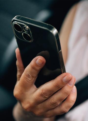 Photo of hand holding mobile phone