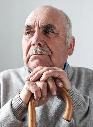 Photo of older man with walking stick