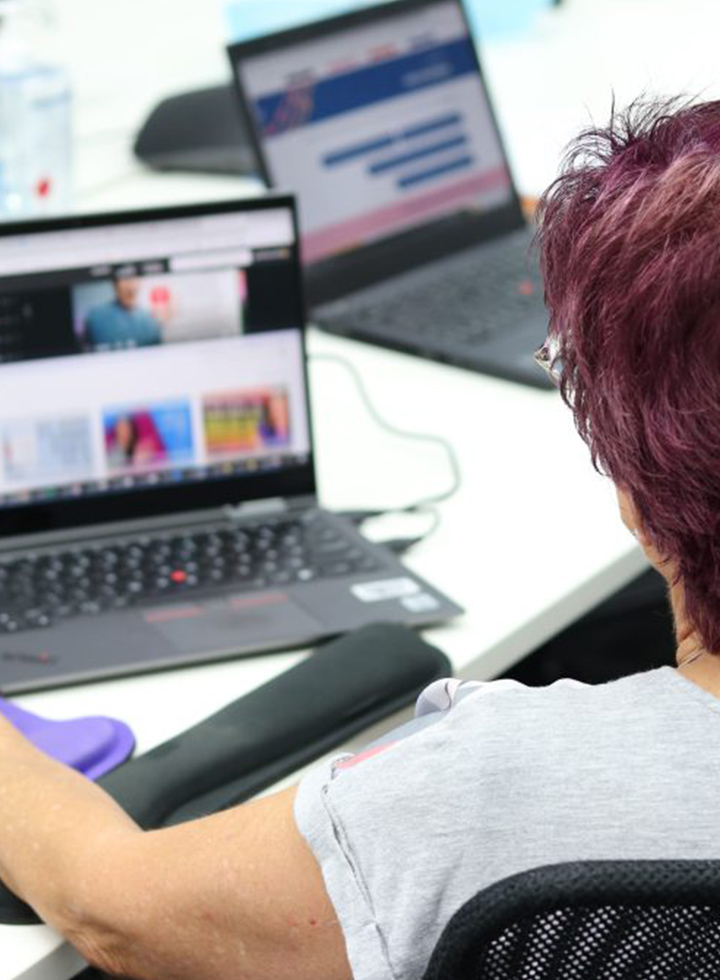 Photo of a person using a laptop