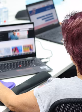 Photo of a person using a laptop