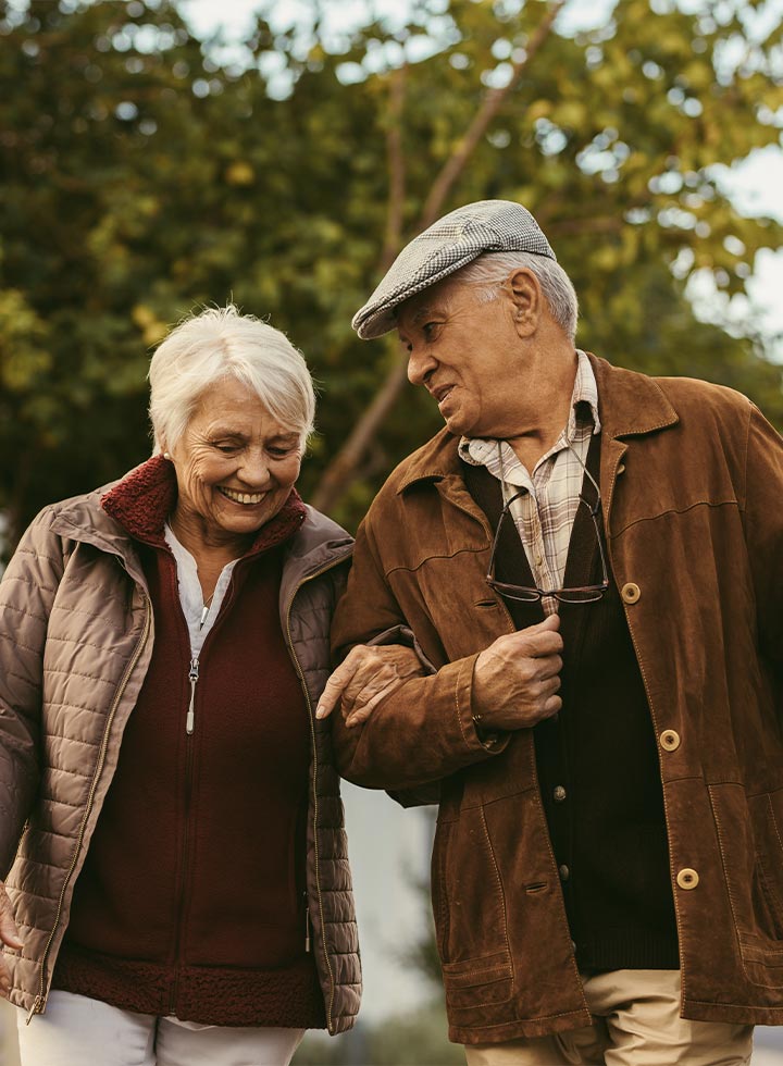 Photo of older couple arm in arm