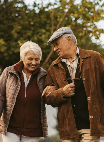 Photo of older couple arm in arm
