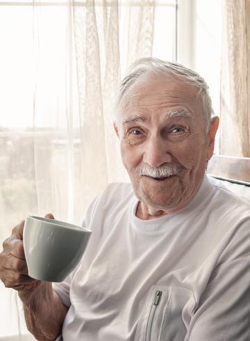 Photo of happy man with cuppa