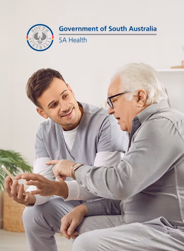Image of an older man with a younger service provider alongside the SA Health logo from the Government of South Australia