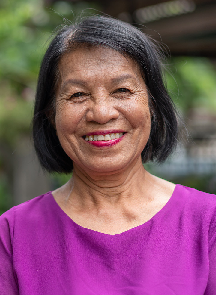 Photo of woman smiling broadly at camera