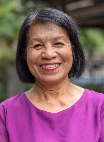 Photo of woman smiling broadly at camera