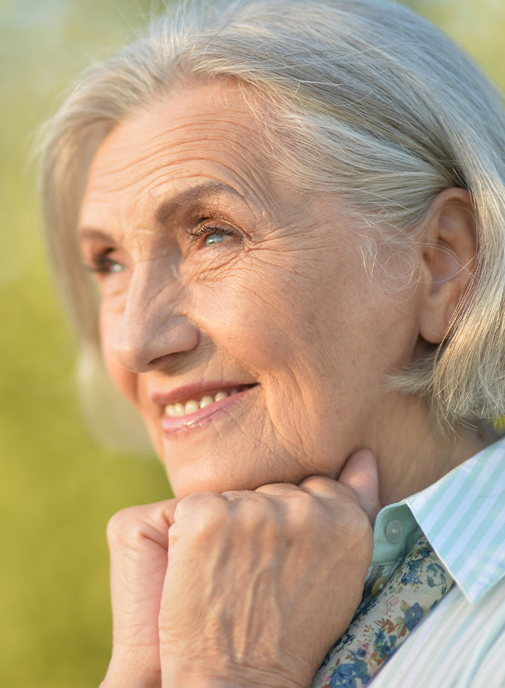 Photo of woman smiling towards the sun