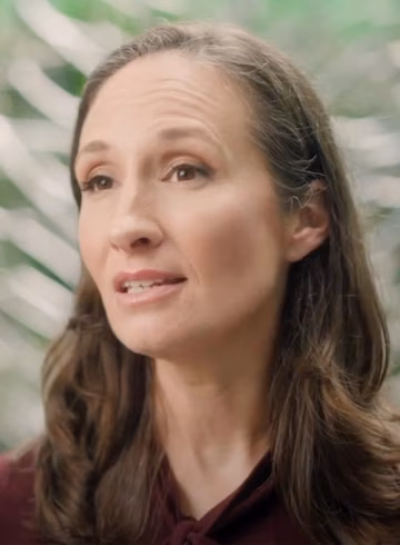 Photo of woman speaking on a video still