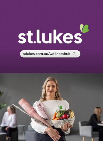 Photo of woman holding a basket of fresh fruit