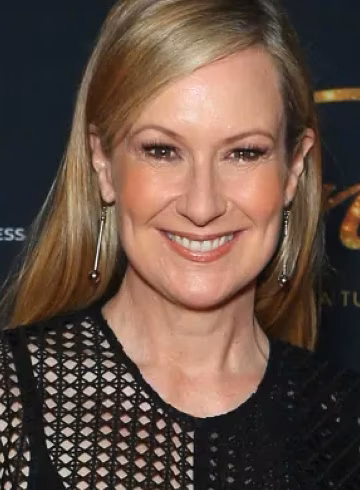 Photo of blonde woman smiling broadly