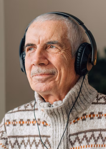 Senior man with headphones on