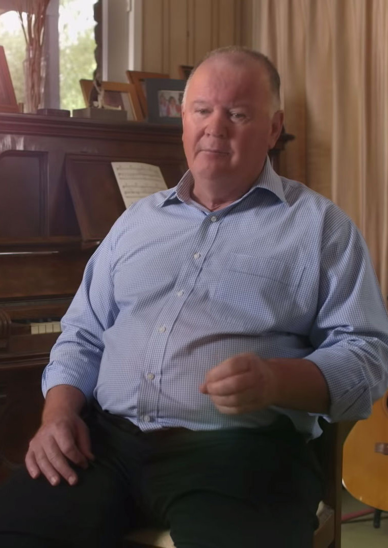 Video still of man being interviewed