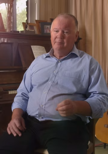Video still of man being interviewed