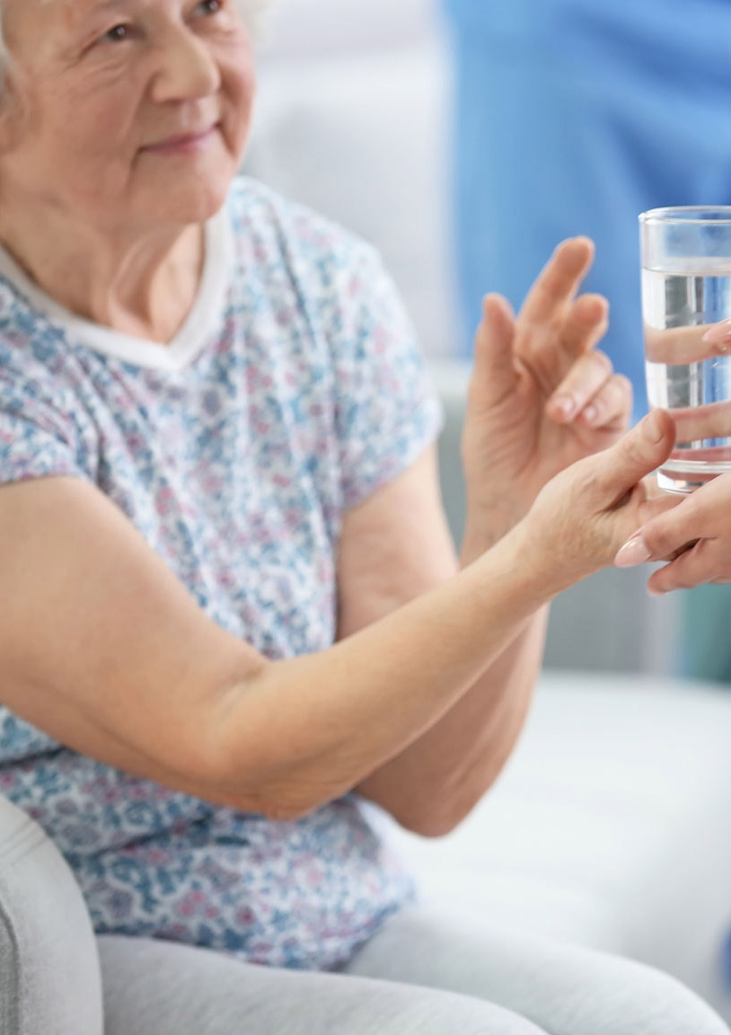 Senior woman with a glass of water