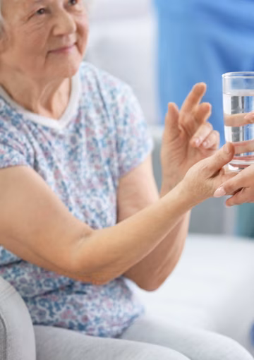 Senior woman with a glass of water