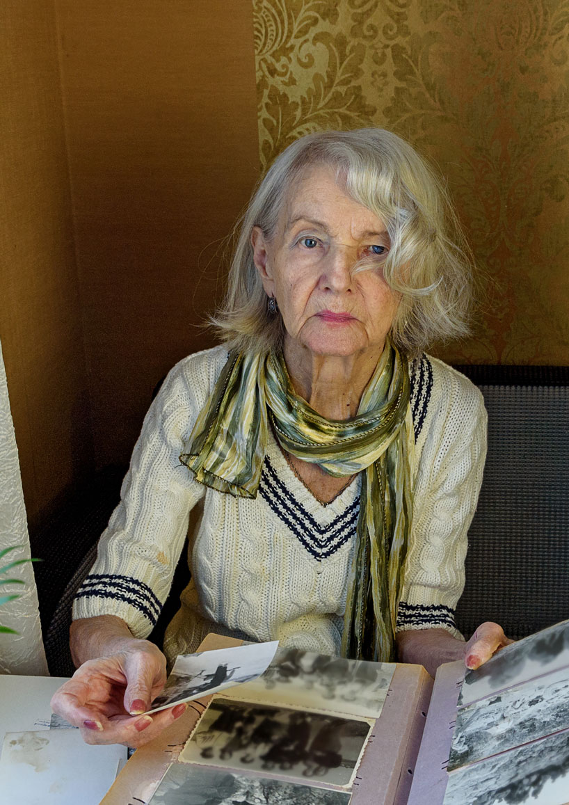 Senior woman looking at old photos